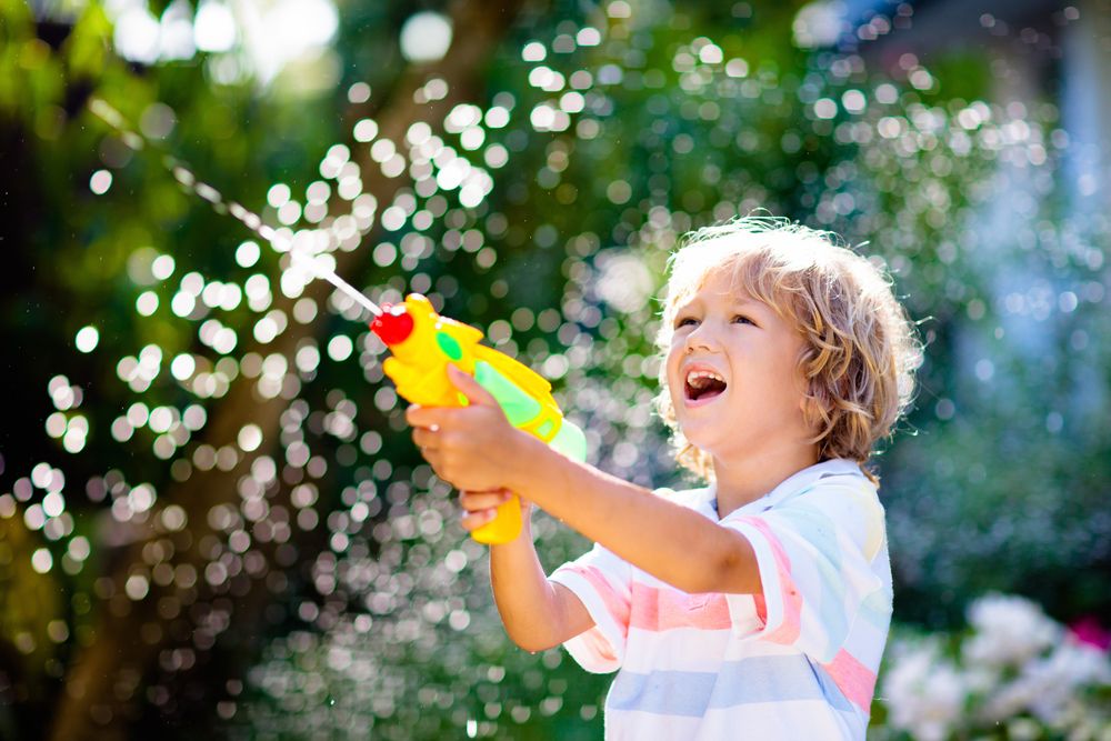 Kids,Play,With,Water,Gun,Toy,In,Garden.,Outdoor,Summer