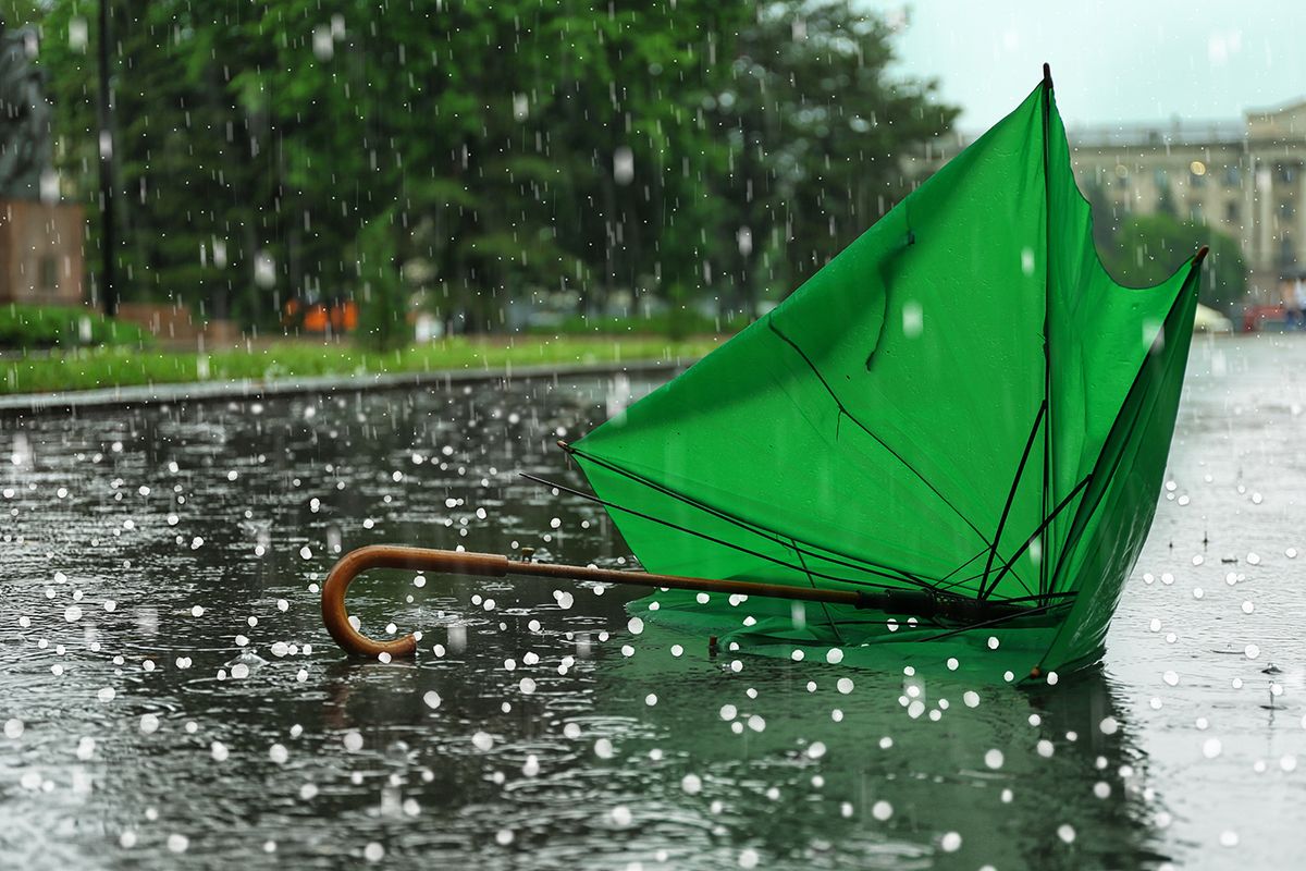 Broken,Green,Umbrella,In,Park,On,Rainy,Day,With,Hail