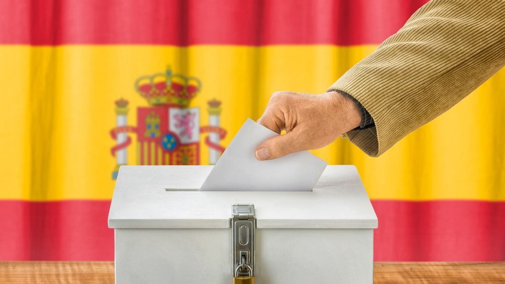 Man,Putting,A,Ballot,Into,A,Voting,Box,-,Spain