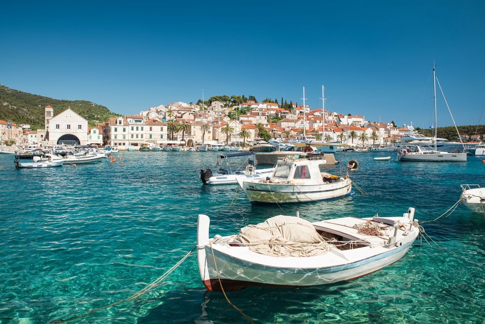 Harbor,With,Boats,In,Turquoise,Waters,On,Island,Hvar,,Croatia