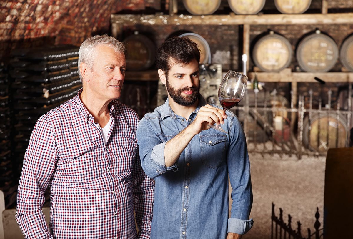 Portrait,Of,Senior,Vintner,And,Young,Winemaker,Tasting,The,New