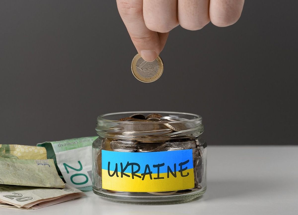 Donation,For,Ukrainian,Refugees.,Donation,For,Ukraine,Concept.,Help,And
donation for ukrainian refugees. Donation for Ukraine concept. Help and financial assistance to Ukraine. donation jar with Ukrainian flag. Ukrainian war, donations,