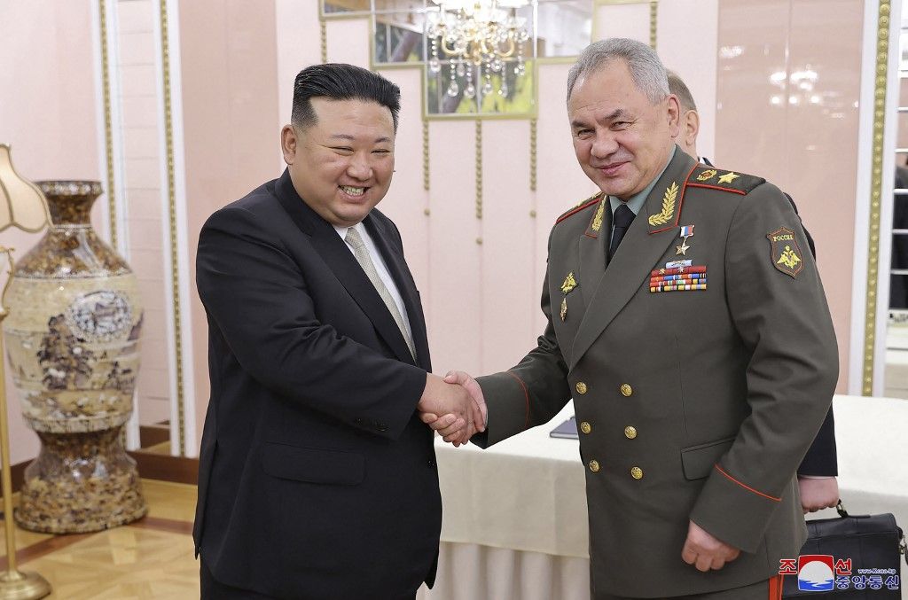 This picture taken on July 26, 2023 and released by North Korea's official Korean Central News Agency (KCNA) on July 27 shows North Korean leader Kim Jong Un (L) and Russian Defence Minister Sergei Shoigu (R) shaking hands at the office building of the Party Central Committee in Pyongyang. (Photo by KCNA VIA KNS / AFP) / - South Korea OUT / ---EDITORS NOTE--- RESTRICTED TO EDITORIAL USE - MANDATORY CREDIT "AFP PHOTO/KCNA VIA KNS" - NO MARKETING NO ADVERTISING CAMPAIGNS - DISTRIBUTED AS A SERVICE TO CLIENTS
THIS PICTURE WAS MADE AVAILABLE BY A THIRD PARTY. AFP CAN NOT INDEPENDENTLY VERIFY THE AUTHENTICITY, LOCATION, DATE AND CONTENT OF THIS IMAGE. / 