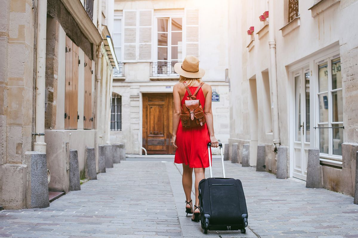 Travel,Background,,Woman,Tourist,Walking,With,Suitcase,On,The,Street
travel background, woman tourist walking with suitcase on the street in european city, tourism in Europe