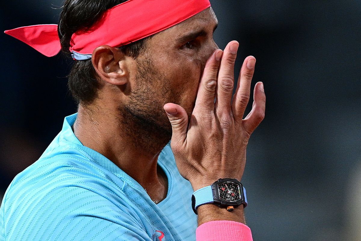 Spain's Rafael Nadal, wearing a watch, reacts as he plays against Italy's Jannik Sinner during their men's singles quarter-final tennis match on Day 10 of The Roland Garros 2020 French Open tennis tournament in Paris on October 6, 2020. (Photo by MARTIN BUREAU / AFP)