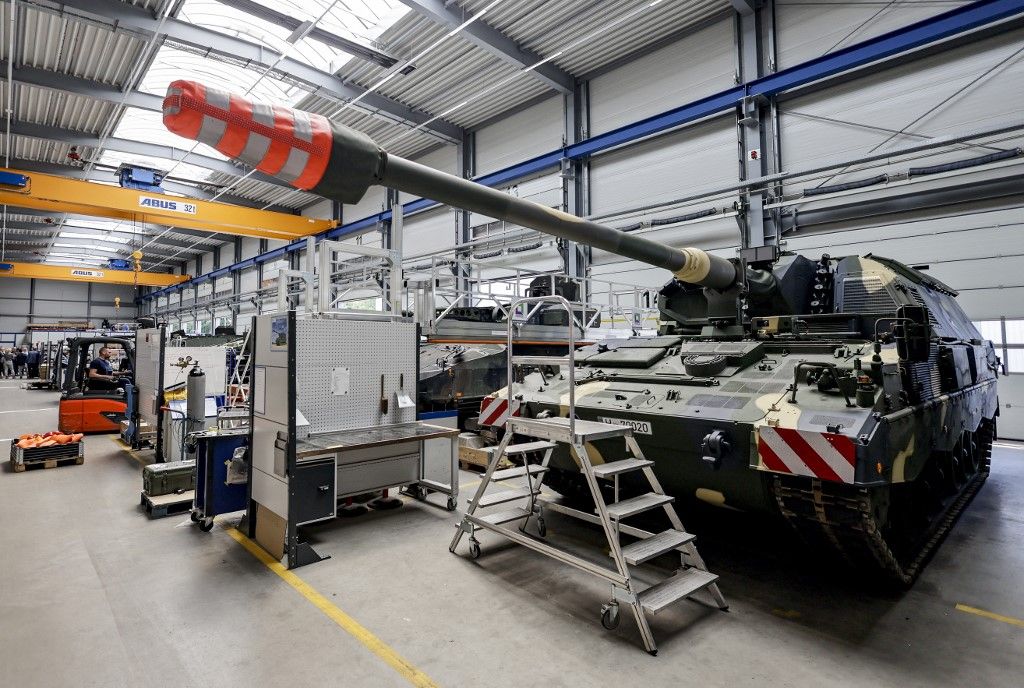 A Panzerhaubitze 2000 (armoured howitzer 2000), a 155mm self-propelled howitzer to be inspected and repaired, is pictured at the facility of German armaments company and automotive supplier Rheinmetall in Unterluess, northern Germany, on June 6, 2023. Since Russia invaded Ukraine, Germany has dropped a traditionally pacifist stance and become one of Ukraine's biggest military backers, delivering a wide array of weaponry to Kyiv. Rheinmetall has received a boost from the Ukraine war, posting record results in 2022 and joining Frankfurt's blue-chip DAX index in March 2023. (Photo by Axel Heimken / AFP)