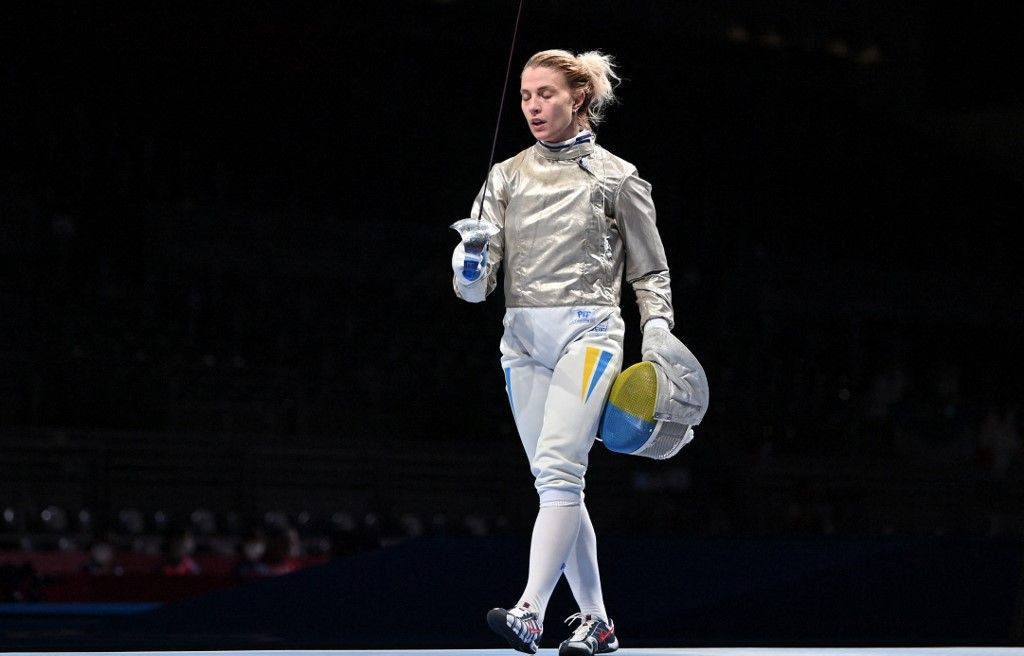 Ukraine's Olga Kharlan reacts after loosing against  China's Yang Hengyu in the women’s individual sabre qualifying bout during the Tokyo 2020 Olympic Games at the Makuhari Messe Hall in Chiba City, Chiba Prefecture, Japan, on July 26, 2021. (Photo by Fabrice COFFRINI / AFP)