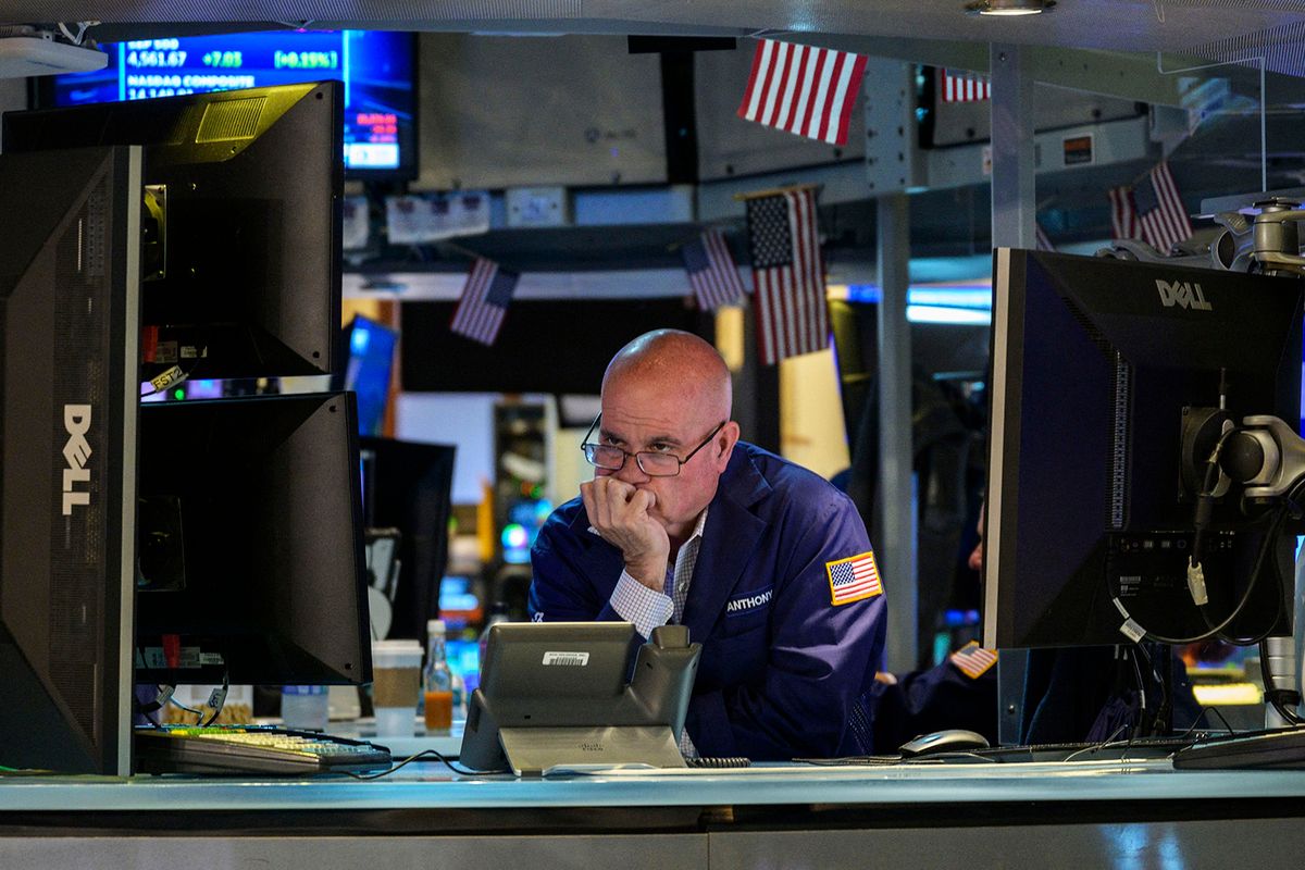 Traders work the floor of the New York Stock Exchange on July 25, 2023, in New York City. Wall Street stocks were mixed early July 25 following a round of generally positive earnings as markets looked ahead to a Federal Reserve interest rate decision. (Photo by ANGELA WEISS / AFP)