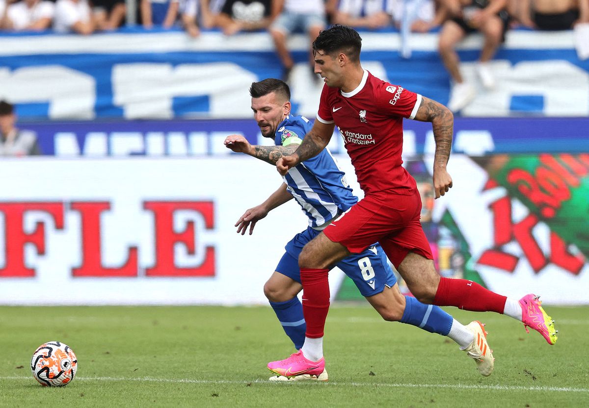 Football: Friendly - Karslruhe v Liverpool
Liverpool's Hungarian midfielder Dominik Szoboszlai and Karlsruhe’s Jerome Gondorf vie for the ball during the pre-season friendly football match between Karlsruhe SC and Liverpool FC in Karlsruhe, western Germany, on July 19, 2023. (Photo by Daniel ROLAND / AFP)