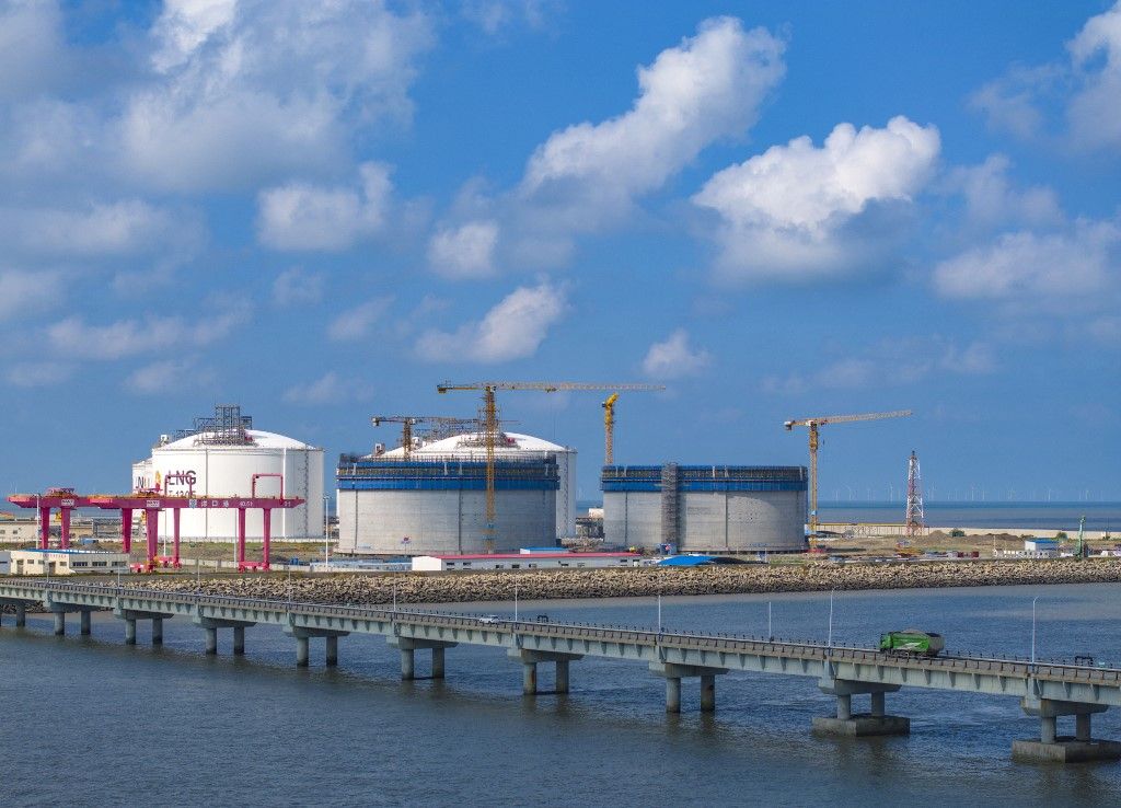 LNG Terminal in NantongNANTONG, CHINA - AUGUST 17, 2023 - A fully loaded Marshall Islands-registered MOZAH docked at petrochina's Jiangsu LNG Terminal in Nantong, Jiangsu province, China, August 17, 2023. It is reported that since the operation in May 2011, the terminal has received and unloaded more than 630 LNG carriers from 25 countries and regions around the world, such as Russia, Peru and Qatar, of which 70% are countries along the ''Belt and Road''. (Photo by Costfoto/NurPhoto) (Photo by CFOTO / NurPhoto / NurPhoto via AFP)