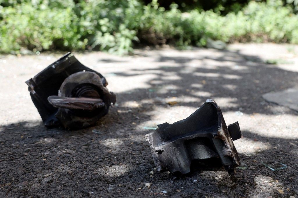 This photograph taken on August 14, 2023, shows missile fragments laying on the ground   after of a night strike in the city of Odesa, amid the Russian invasion in Ukraine. Ukraine downed three waves of Russian missiles and drones targeting Odesa, its army said early on August 14, 2023, the latest in a string of attacks in the southern region on the Black Sea coast. (Photo by Oleksandr GIMANOV / AFP)