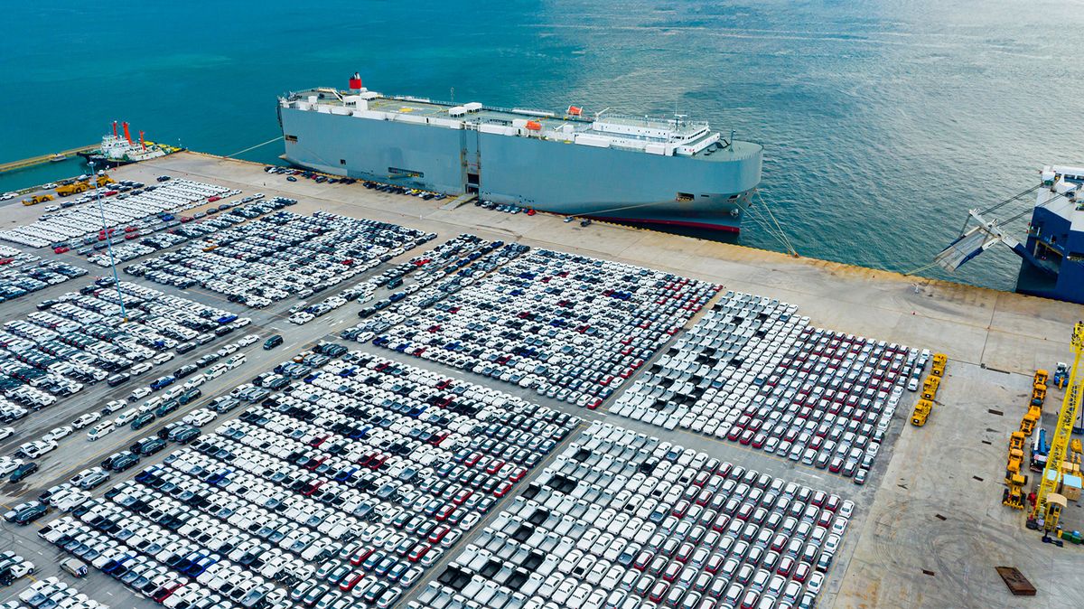 Aerial view cargo ship transportation of business logistic sea freight, New Cars produced by year up in the port for Cargo ship and Cargo import-export around in the world