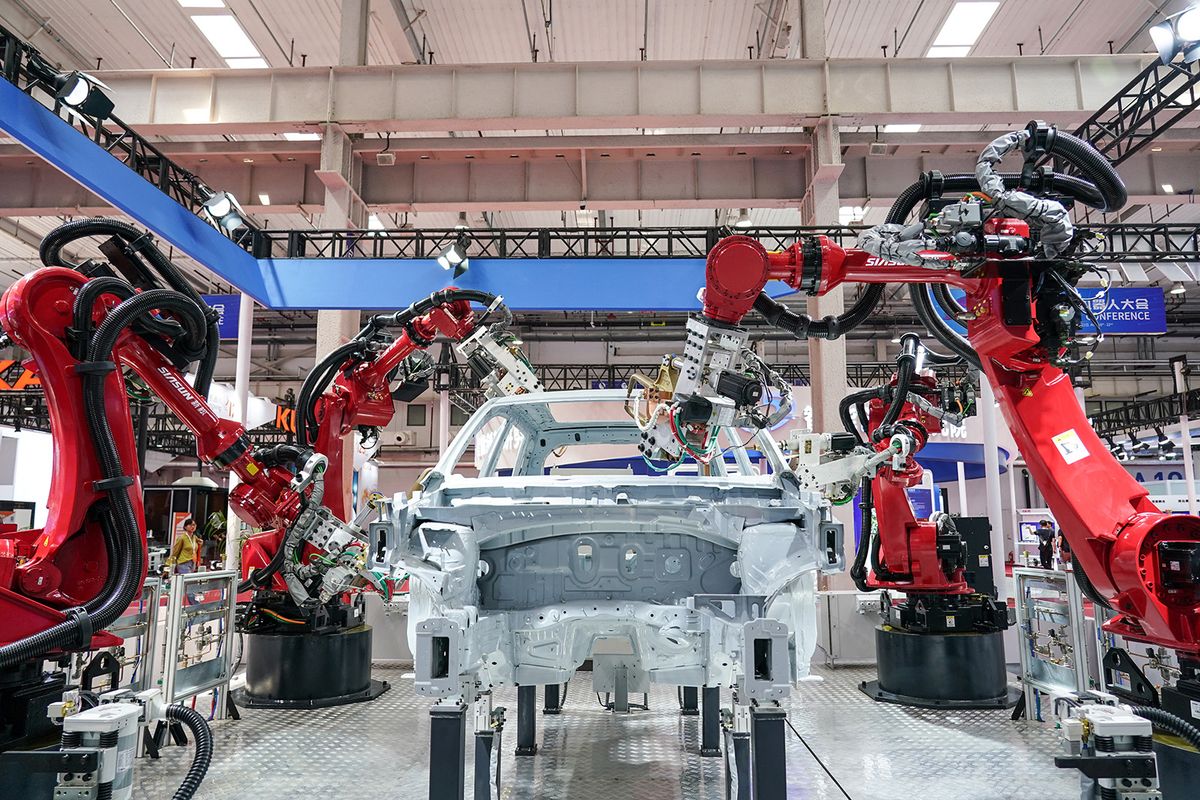 (230816) -- BEIJING, Aug. 16, 2023 (Xinhua) -- Welding robots are pictured at the World Robot Conference 2023 in Beijing, capital of China, Aug. 16, 2023. The World Robot Conference 2023 opened here Wednesday, showcasing cutting-edge achievements and the latest robot industry exhibits. (Xinhua/Peng Ziyang) (Photo by Peng Ziyang / XINHUA / Xinhua via AFP)