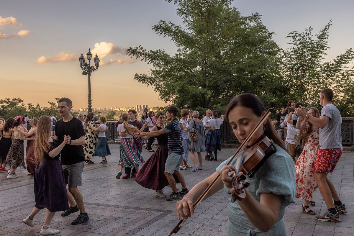 People perform Ukrainian folk dance at Saint Volodymyr Hill in downtown Kyiv, on August 3, 2023, amid the Russian invasion of Ukraine. (Photo by Roman PILIPEY / AFP)