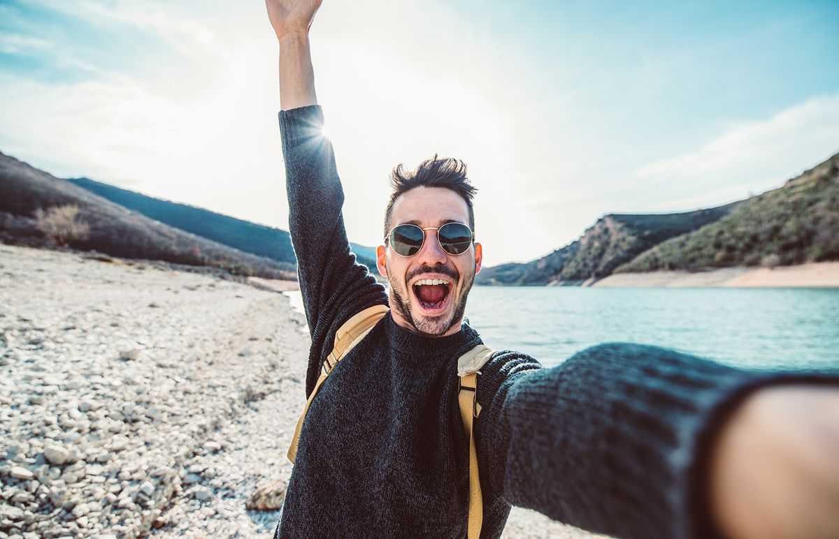 Happy,Handsome,Man,Takes,A,Selfie,Portrait,At,Vacation,Outdoor.
Happy handsome man takes a selfie portrait at vacation outdoor. Travel backpacker concept