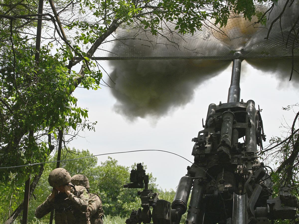 Ukrainian artillerymen fire a M777 howitzer toward Russian positions near Avdiivka in the Donetsk region on June 23, 2023, amid the Russian invasion of Ukraine. (Photo by Genya SAVILOV / AFP)