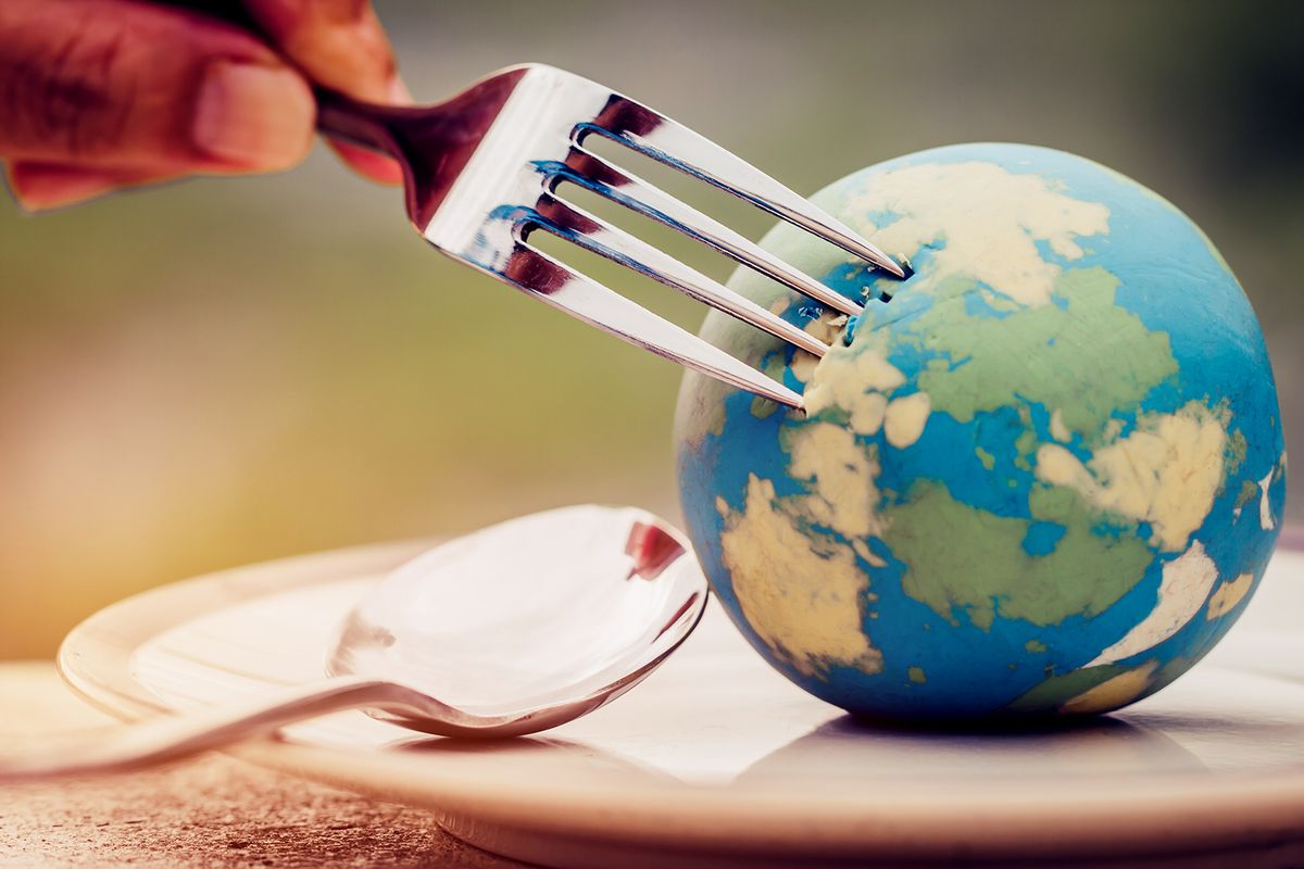 Fork,Slammed,On,Globe,Model,Placed,On,Plate,For,Serve
Fork slammed on Globe model placed on plate  for serve menu in famous hotel. International cuisine is practiced around the world often associated with specific region country. World food inter concept