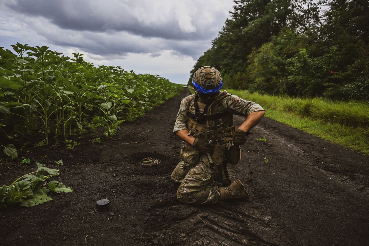 DONETSK, UKRAINE - JULY 11: Ukrainian army's 35th Marine Brigade members conduct mine clearance work at a field in Donetsk, Ukraine on July 11, 2023. ErĂ§in ErtĂĽrk / Anadolu Agency (Photo by ErĂ§in ErtĂĽrk / ANADOLU AGENCY / Anadolu Agency via AFP)