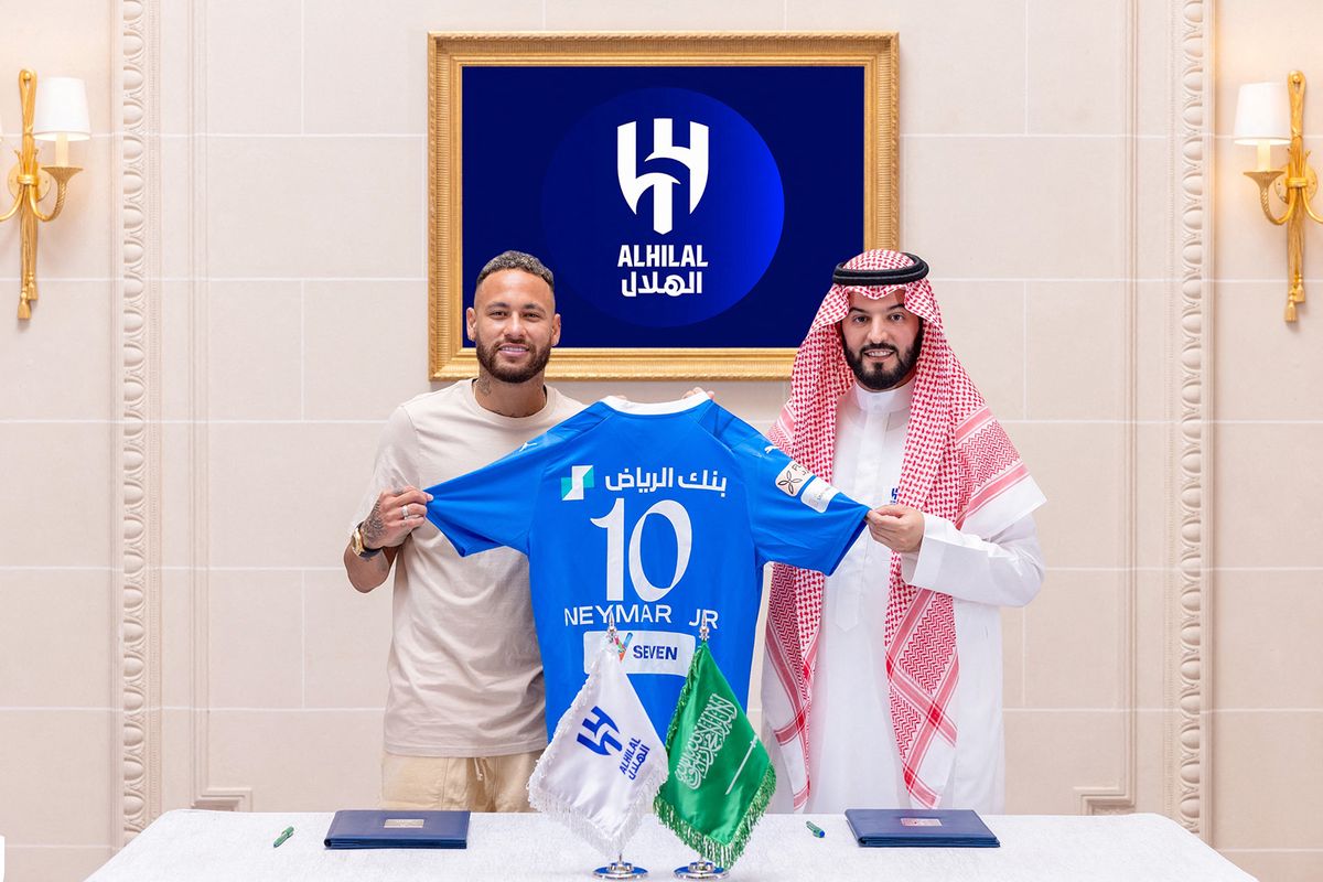 In this handout picture released by the Saudi Al-Hilal football club on August 15, 2023, Brazilian forward Neymar (L) poses for a picture with Hilal President Fahad bin Nafel in Paris. Brazil forward Neymar has signed for Saudi Arabia's Al-Hilal from Paris Saint-Germain, the clubs announced today, joining Cristiano Ronaldo and Karim Benzema as the latest big name lured to the oil-rich Gulf state. (Photo by Saudi Pro League / AFP) / “The erroneous mention[s] appearing in the metadata of this photo by - has been modified in AFP systems in the following manner: [in Paris] instead of [in Riyadh]. Please immediately remove the erroneous mention[s] from all your online services and delete it (them) from your servers. If you have been authorized by AFP to distribute it (them) to third parties, please ensure that the same actions are carried out by them. Failure to promptly comply with these instructions will entail liability on your part for any continued or post notification usage. Therefore we thank you very much for all your attention and prompt action. We are sorry for the inconvenience this notification may cause and remain at your disposal for any further information you may require.”