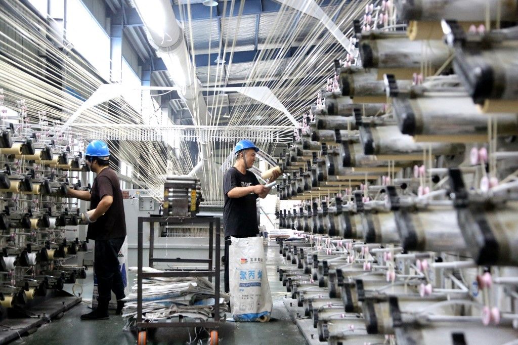 Industrial Enterprises Profits Decline in ChinaLIANYUNGANG, CHINA - AUGUST 27, 2023 - A worker works at a production workshop at a woven bag factory in Lianyungang, East China's Jiangsu province, Aug 27, 2023. On the same day, the National Bureau of Statistics released data, from January to July, the total profit of industrial enterprises above designated size in the country was 3,943.98 billion yuan, down 15.5% year-on-year, and the decline was 1.3 percentage points narrower than that in January to June. (Photo by Costfoto/NurPhoto) (Photo by CFOTO / NurPhoto / NurPhoto via AFP)