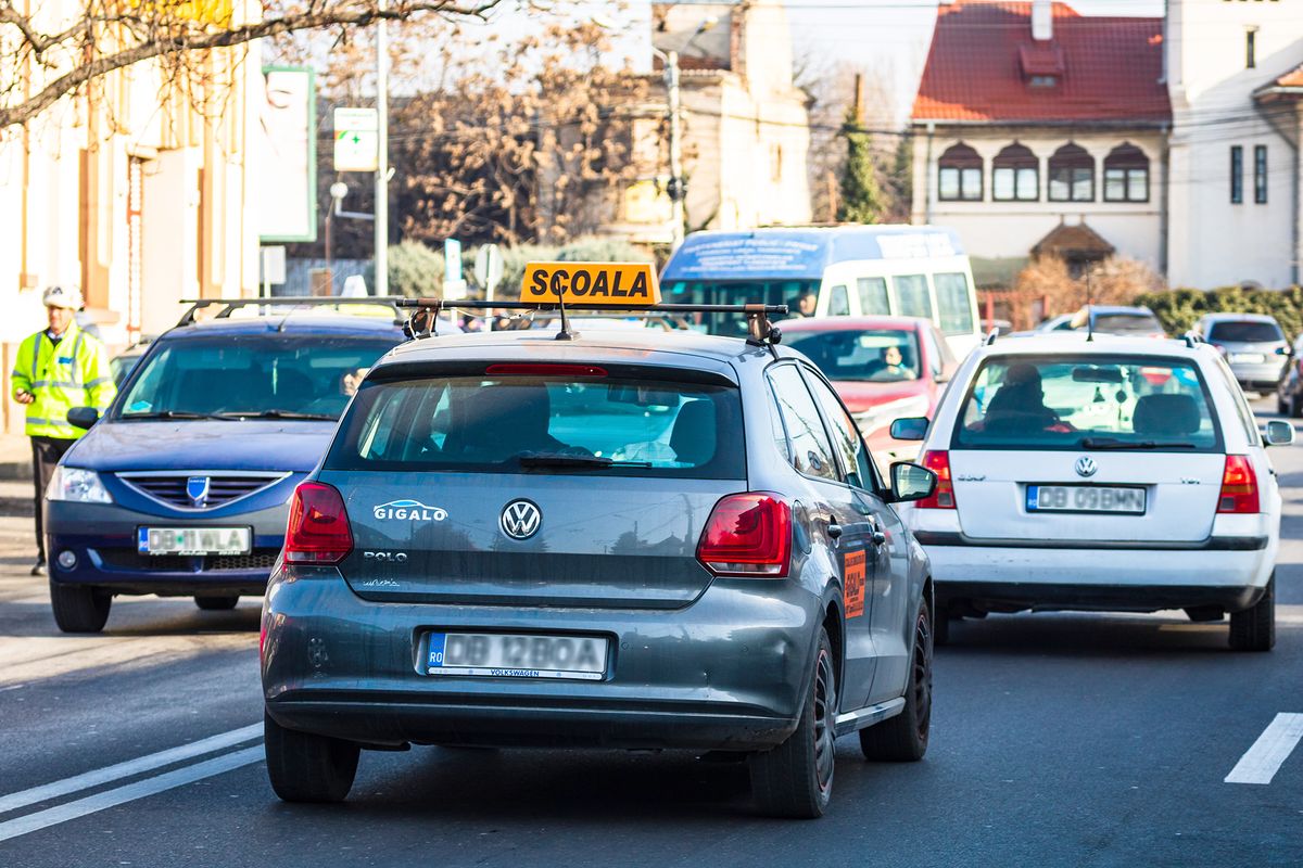 Driving,School,Car,In,Traffic,In,Targoviste,,Romania,,2020.
Driving school car in traffic in Targoviste, Romania, 2020.