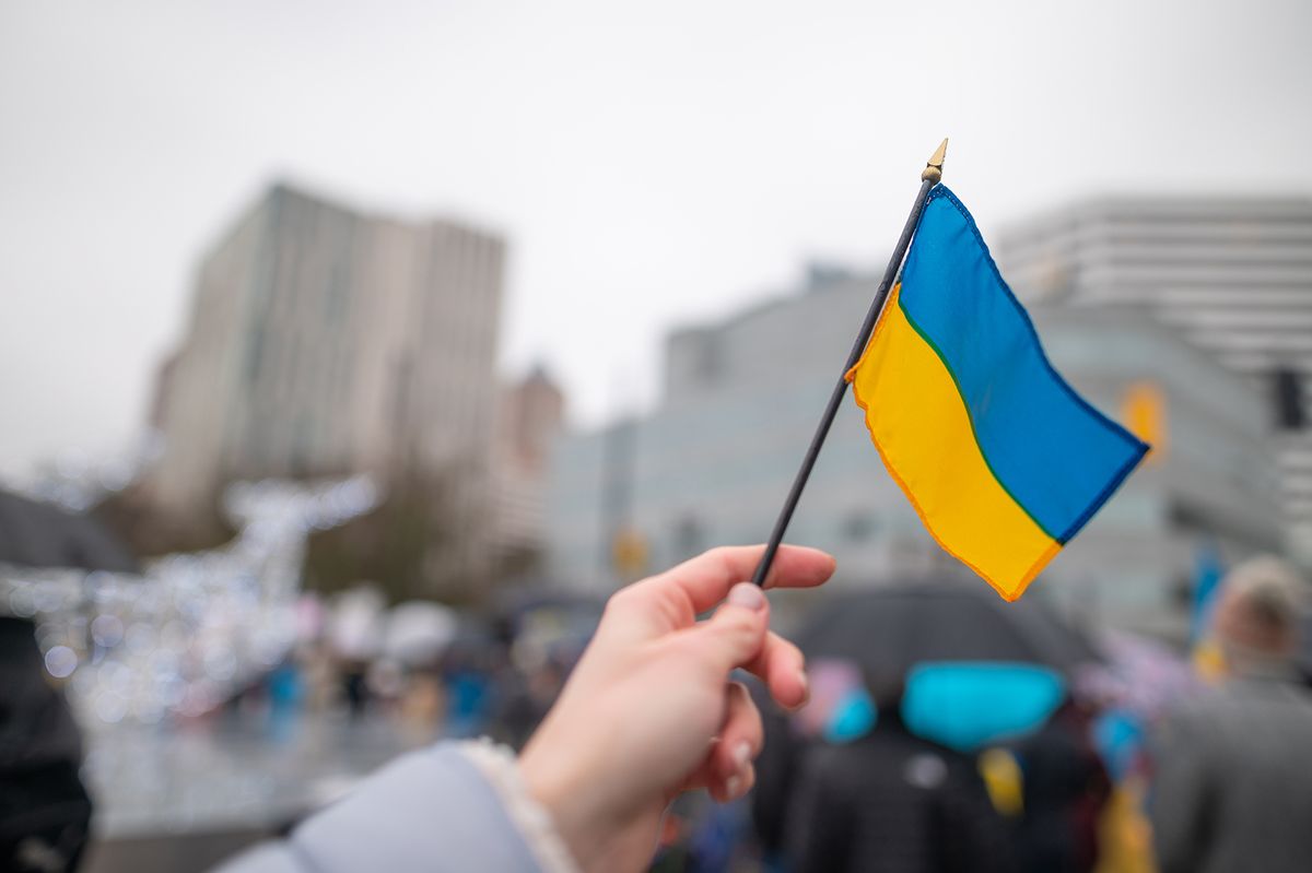 Ukrainian,Flag,On,The,Background,Of,The,Rally.,No,War.
Ukrainian flag on the background of the rally. No war. Support for Ukraine