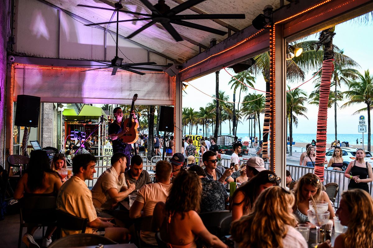 Spring Break returns to Miami Beach to the annoyance of its residents
A musician performs in a restaurant on Las Olas Boulevard in Fort Lauderdale, Florida, March 16, 2022. Music, dancing, alcohol and tiny swimsuits -- spring vacation in the United States, popularly known as "spring break," brings thousands of young people to south Florida every year for a few days of uncontrolled fun, much to the chagrin of residents in cities like Miami Beach. (Photo by CHANDAN KHANNA / AFP)
