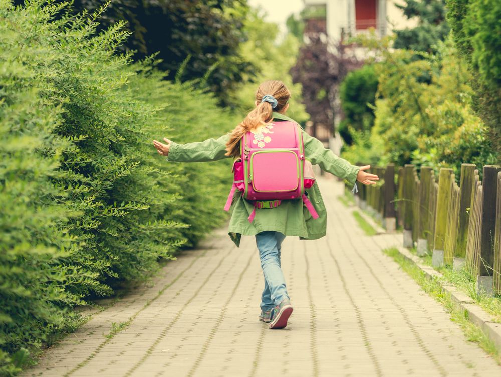 Little,Girl,With,A,Backpack,Going,To,School.,Back,View