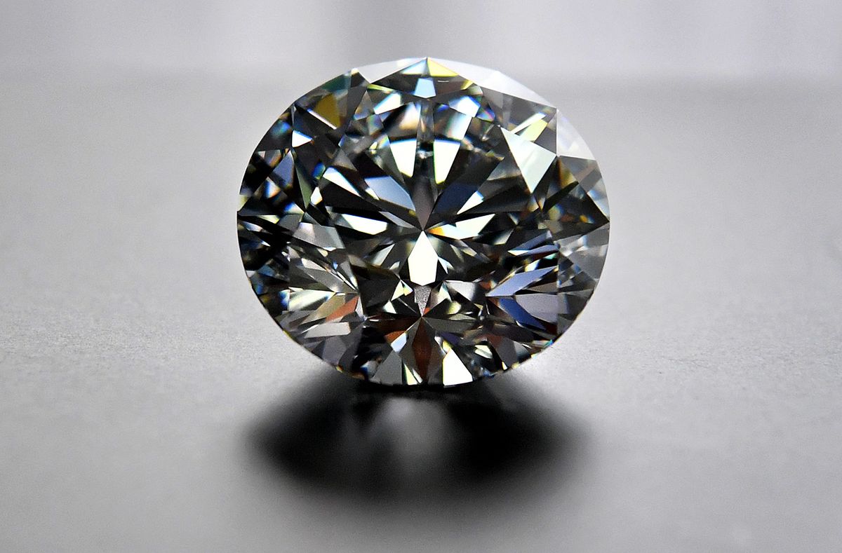 A close-up view of the main 51.38-carat round-cut diamond, the Dynasty, from Russian diamond miner Alrosa’s Dynasty polished diamonds collection in Moscow on August 3, 2017. The collection of five polished stones was manufactured from a 179-carat Romanovs rough diamond, extracted at the company’s Nyurbinskaya kimberlite pipe in Russia's far northeast region of Yakutia in 2015. Alrosa plans to sell the whole collection in one set at a special online auction in November with the starting price not less than $10 million, according to the company’s CEO Ivanov. (Photo by Yuri KADOBNOV / AFP)