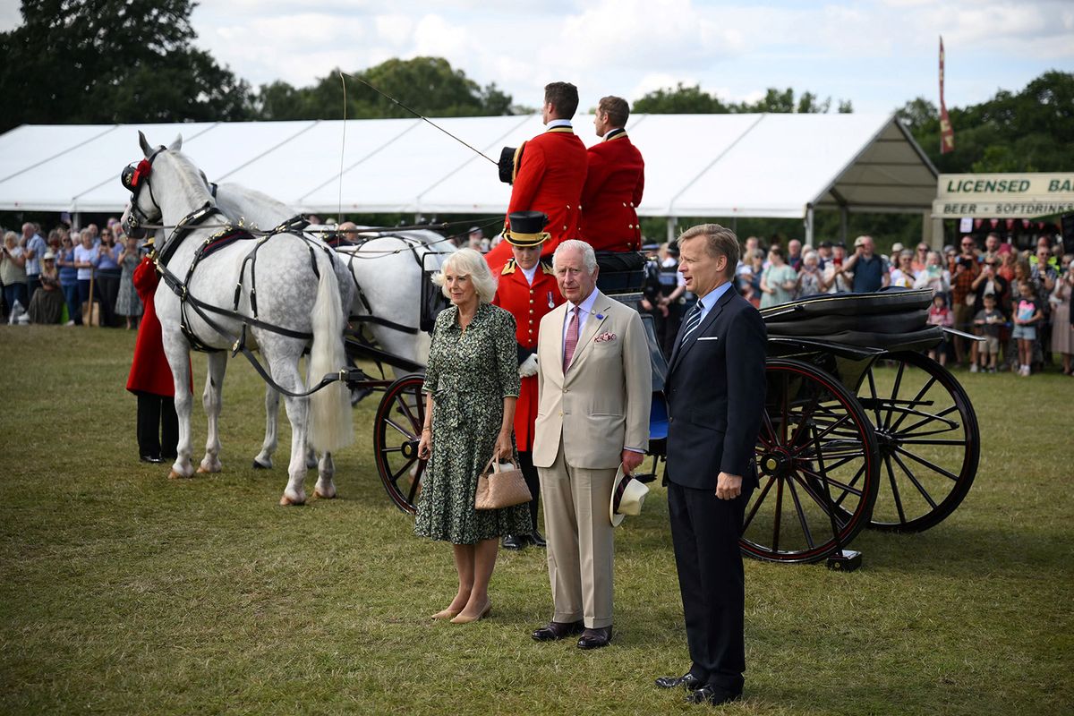 Britain's King Charles III and Britain's Queen Camilla arrive by horse carriage for a visit of the Sandringham Flower Show, in Sandrigham, north west England, on July 26, 2023. (Photo by Daniel LEAL / POOL / AFP)
