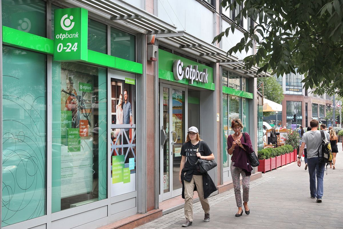 Budapest,,Hungary,-,June,22,,2014:,People,Walk,By,Otp
BUDAPEST, HUNGARY - JUNE 22, 2014: People walk by OTP Bank in Budapest. OTP is the biggest commercial Hungarian bank with 1500 branches in 9 countries.