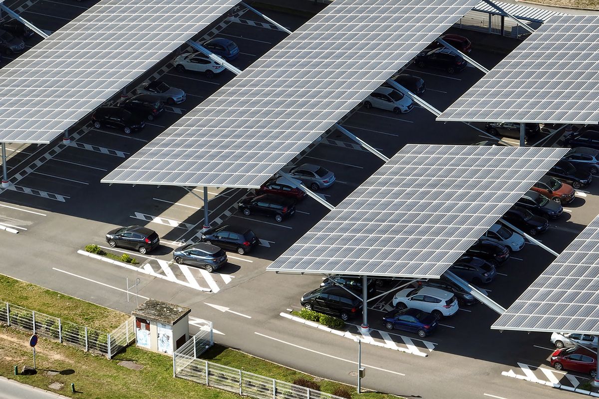Aerial,View,Of,Solar,Panels,Installed,Over,Parking,Lot,With