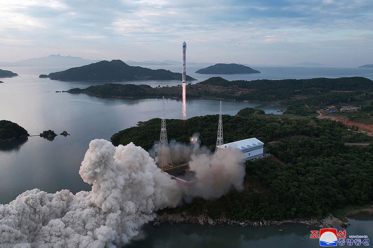 This picture taken on May 31, 2023 and released from North Korea's official Korean Central News Agency (KCNA) on June 1, 2023 shows a new satellite-carrying rocket as it leaves the launch pad, at an undisclosed location in North Korea. North Korea attempted to launch a spy satellite on May 31 but it crashed into the sea after a rocket failure, with the South Korean military retrieving part of the likely wreckage in a potential intelligence bonanza. (Photo by KCNA VIA KNS / AFP) / South Korea OUT / ---EDITORS NOTE--- RESTRICTED TO EDITORIAL USE - MANDATORY CREDIT "AFP PHOTO/KCNA VIA KNS" - NO MARKETING NO ADVERTISING CAMPAIGNS - DISTRIBUTED AS A SERVICE TO CLIENTS / THIS PICTURE WAS MADE AVAILABLE BY A THIRD PARTY. AFP CAN NOT INDEPENDENTLY VERIFY THE AUTHENTICITY, LOCATION, DATE AND CONTENT OF THIS IMAGE --- /