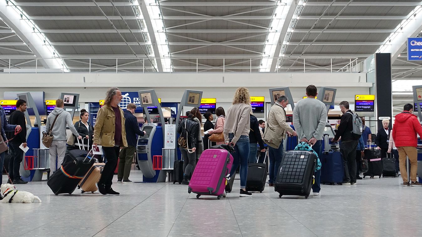 London, UK - April 15, 2018: Air travellers check into flights at Terminal 5 of Heahthrow Airport. Heathrow is one of the busiest airports in the world and busiest in Europe by passenger volume,