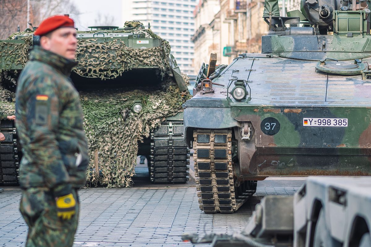 Vilnius,,Lithuania,-,February,16,2022:,German,Army,,Nato,Response
Vilnius, Lithuania - February 16 2022: German army, NATO response force or North Atlantic Treaty Organization armored crawler tanks and other military vehicles on the road of the city with soldiers