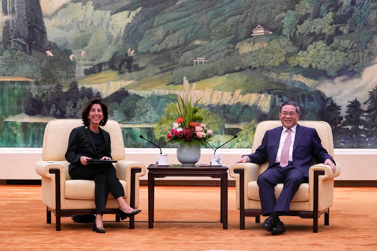 China's Premier Li Qiang (R) speaks with US Commerce Secretary Gina Raimondo during their meeting at the Great Hall of the People in Beijing on August 29, 2023. (Photo by Andy Wong / POOL / AFP)