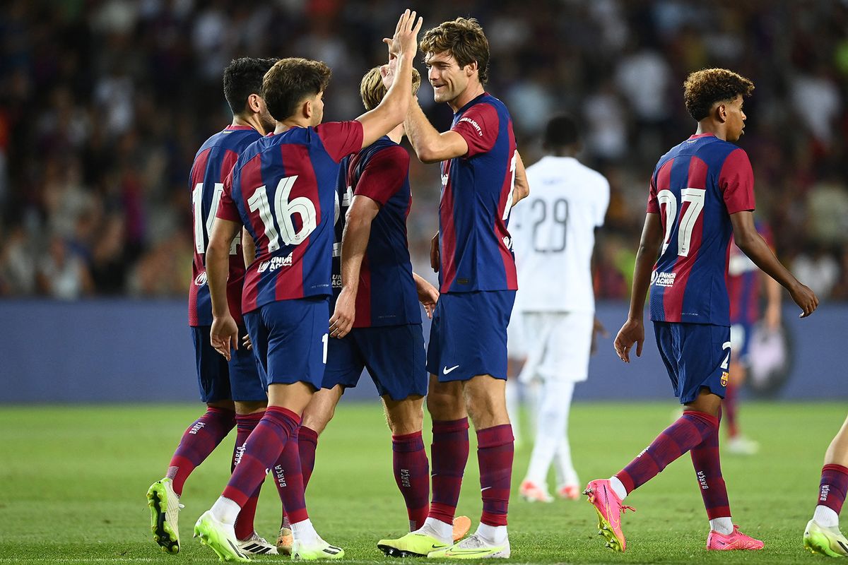 Barcelona's Spanish defender #17 Marcos Alonso (C) celebrates with teammates at the end of the 58th Joan Gamper Trophy football match between FC Barcelona and Tottenham Hotspur FC at the Estadi Olimpic Lluis Companys in Barcelona on August 8, 2023. (Photo by Pau BARRENA / AFP)