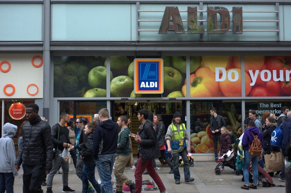 Aspects of the UK retail industryPeople walking by the Aldi supermarket in central Manchester. (Photo by Jonathan Nicholson/NurPhoto) (Photo by Jonathan Nicholson / NurPhoto / NurPhoto via AFP)