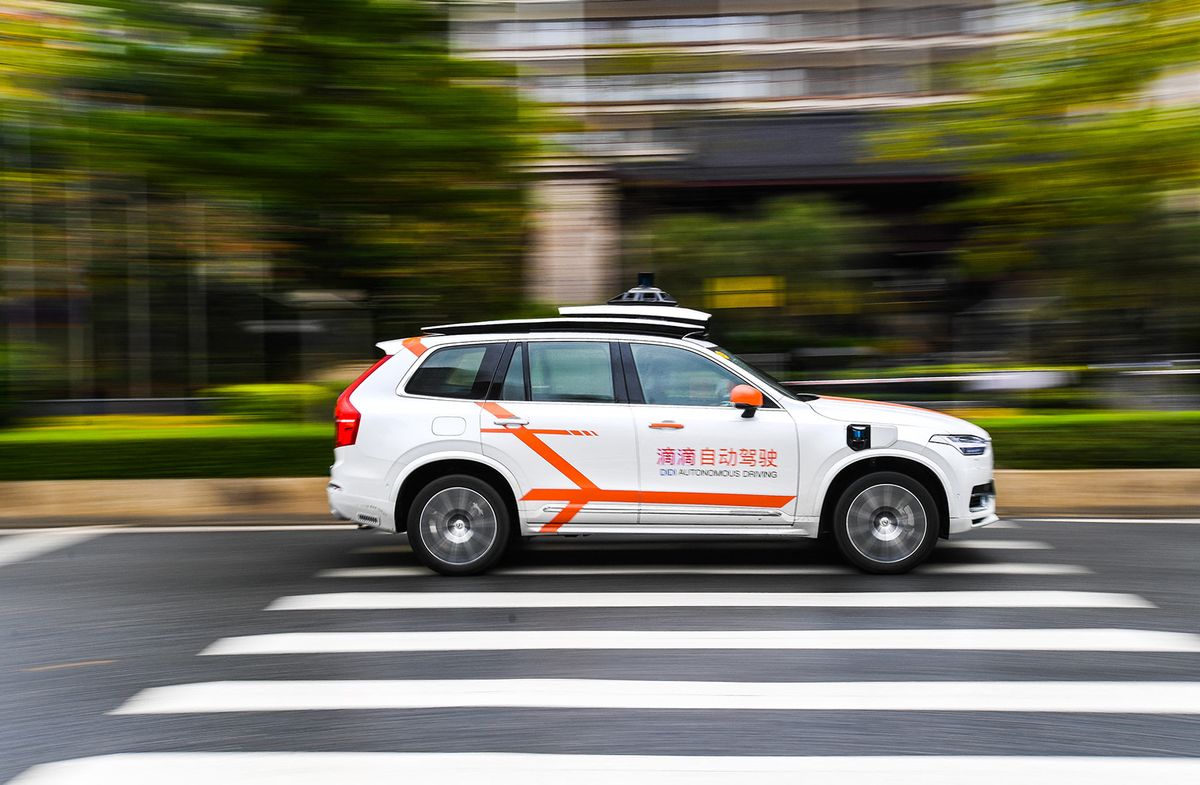 (230327) -- GUANGZHOU, March 27, 2023 (Xinhua) -- A Didi autonomous driving vehicle runs on a street in Huadu District of Guangzhou, south China's Guangdong Province, March 27, 2023. The first batch of Didi autonomous driving vehicles started commercialized demonstration operation here on Monday. Passengers can place an order to book vehicles in the Didi Robotaxi applet, experience autonomous driving service, and pay according to the actual mileage and duration of use. (Xinhua/Liu Dawei) (Photo by Liu Dawei / XINHUA / Xinhua via AFP)