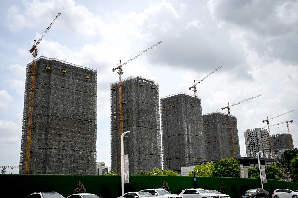 (FILES) A general view shows Evergrande residential buildings under construction in Guangzhou, in China’s southern Guangdong province on July 18, 2022. Embattled Chinese property giant Evergrande Group filed for bankruptcy protection in the United States on August 17, 2023, court documents showed, a measure that protects its US assets while it attempts to restructure. (Photo by JADE GAO / AFP)