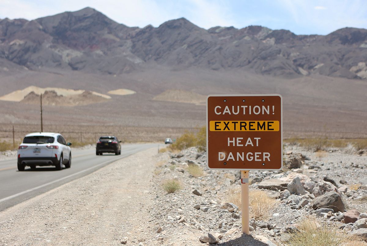 US-CLIMATE-WEATHER-HEAT
A heat advisory sign is shown along US highway 190 during a heat wave in Death Valley National Park in Death Valley, California, on July 16, 2023. Tens of millions of Americans braced for more sweltering temperatures Sunday as brutal conditions threatened to break records due to a relentless heat dome that has baked parts of the country all week. By the afternoon of July 15, 2023, California's famous Death Valley, one of the hottest places on Earth, had reached a sizzling 124F (51C), with Sunday's peak predicted to soar as high as 129F (54C). Even overnight lows there could exceed 100F (38C). (Photo by Ronda Churchill / AFP)