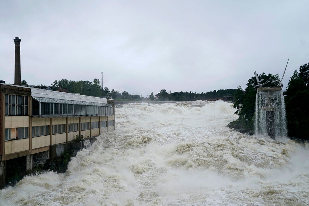 A photo shows the Storelva river flowing through Hoenefoss, Norway on August 9, 2023. Norwegian authorities said on August 9 thousands had been evacuated following massive floods and that they were considering blowing open a dam after the floodgates failed to open. Norway's armed forces said they had been asked to assist police at the Braskereidfoss hydroelectric power station, which lies along the Glomma river -- the longest in Norway -- to evaluate whether the gates would need to be blasted open. (Photo by Annika Byrde / NTB / AFP) / Norway OUT