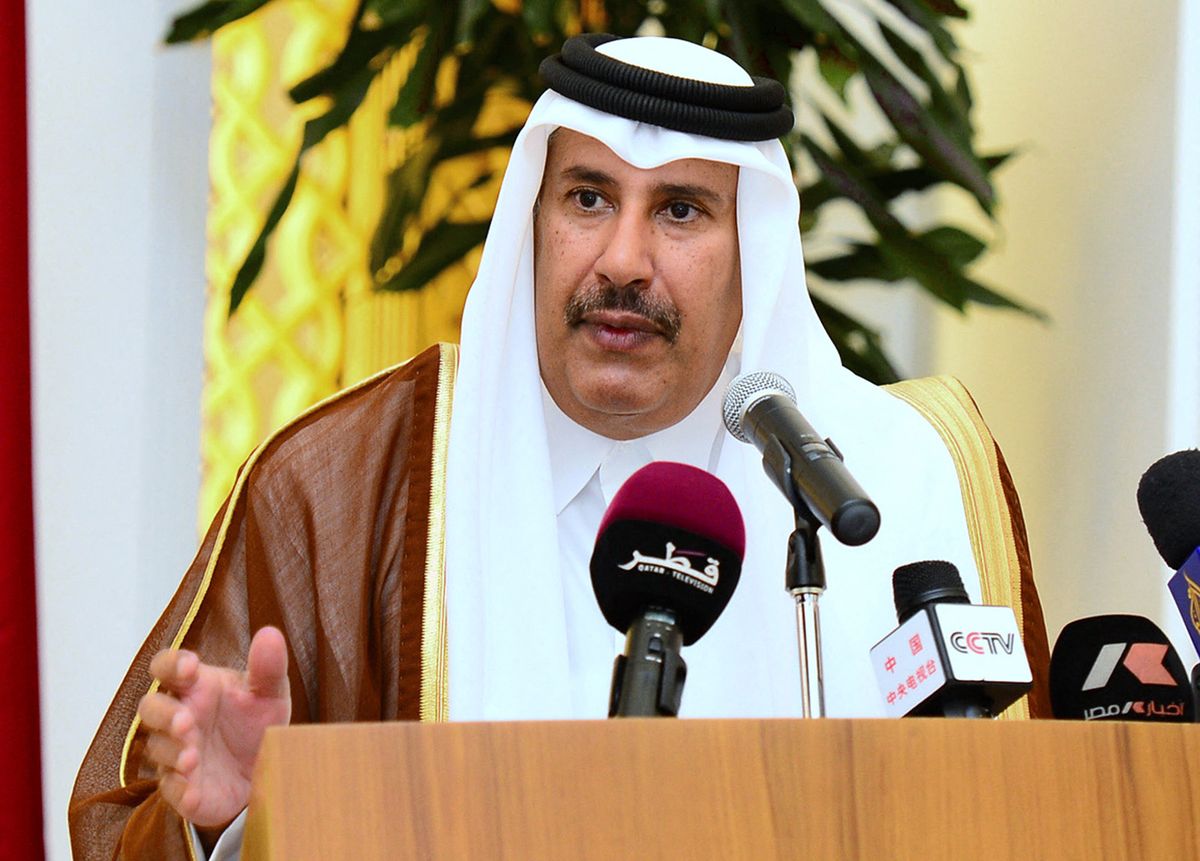 Qatar's Premier and Foreign Minister Sheikh Hamad bin Jassem bin Jabr al-Thani speaks during a joint press conference with Egyptian Prime Minister Hisham Qandil (unseen) in Doha on April 10, 2013. Energy-rich Qatar has agreed to buy bonds from cash-strapped Egypt worth $3 billion over and above a previously announced aid package Al- Thani said. AFP PHOTO/STR (Photo by AFP)