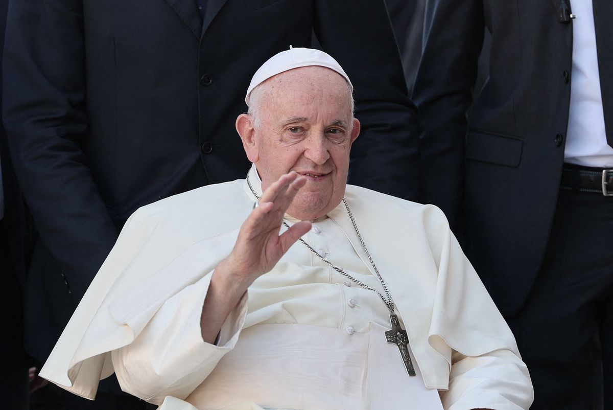 Pope Francis waves during his visit to the Serafina parish social centre to meet with representatives of volunteers and charity centres, in Lisbon, on August 4, 2023. Around one million pilgrims from all over the world will attend the World Youth Day, the largest Catholic gathering in the world, created in 1986 by John Paul II. (Photo by Thomas COEX / AFP)