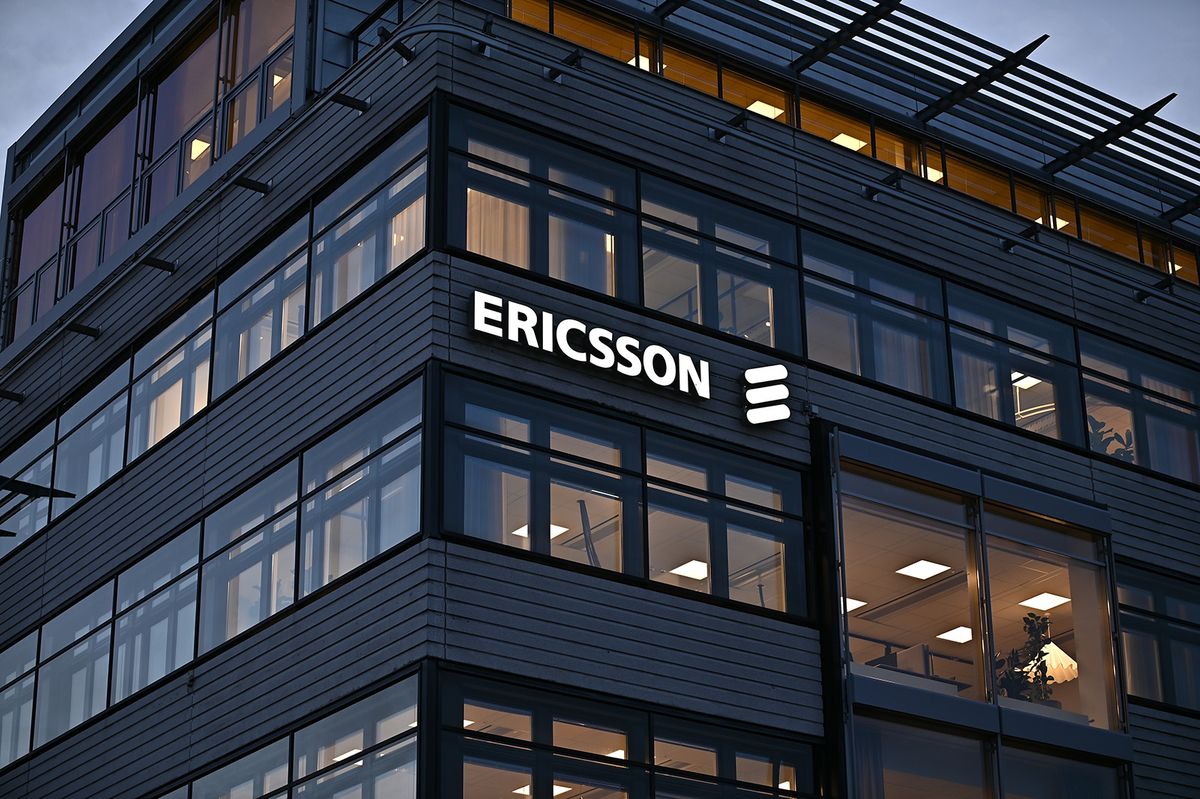 Stockholm, Sweden - October 8, 2021: An office building at dusk with a lit wall sign for the Swedish telecommunications company Ericsson in Stockholm, Sweden.