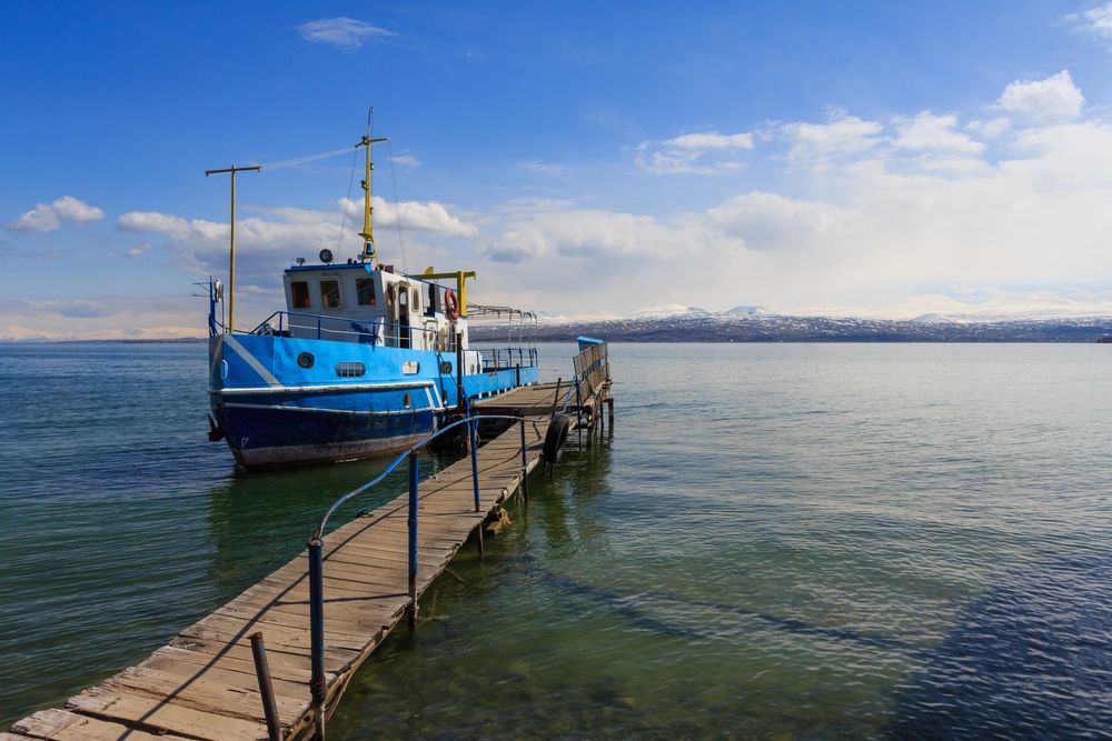 The,Blue,Ship,Stands,At,The,Pier,Of,Lake,Sevan.