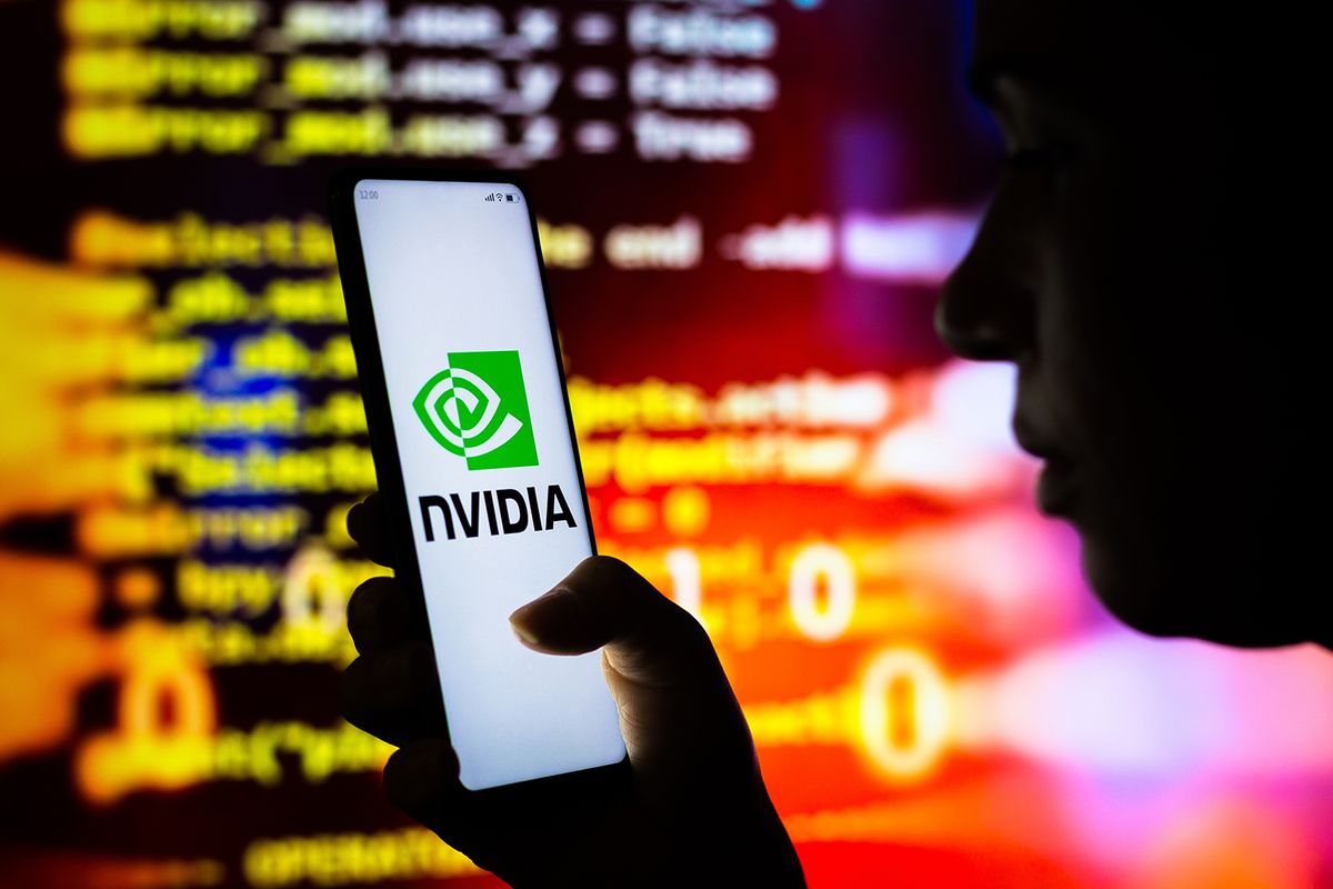 August,18,,2022,,Brazil.,In,This,Photo,Illustration,,A,Woman
August 18, 2022, Brazil. In this photo illustration, a woman holds a smartphone with the Nvidia Corporation logo displayed on the screen