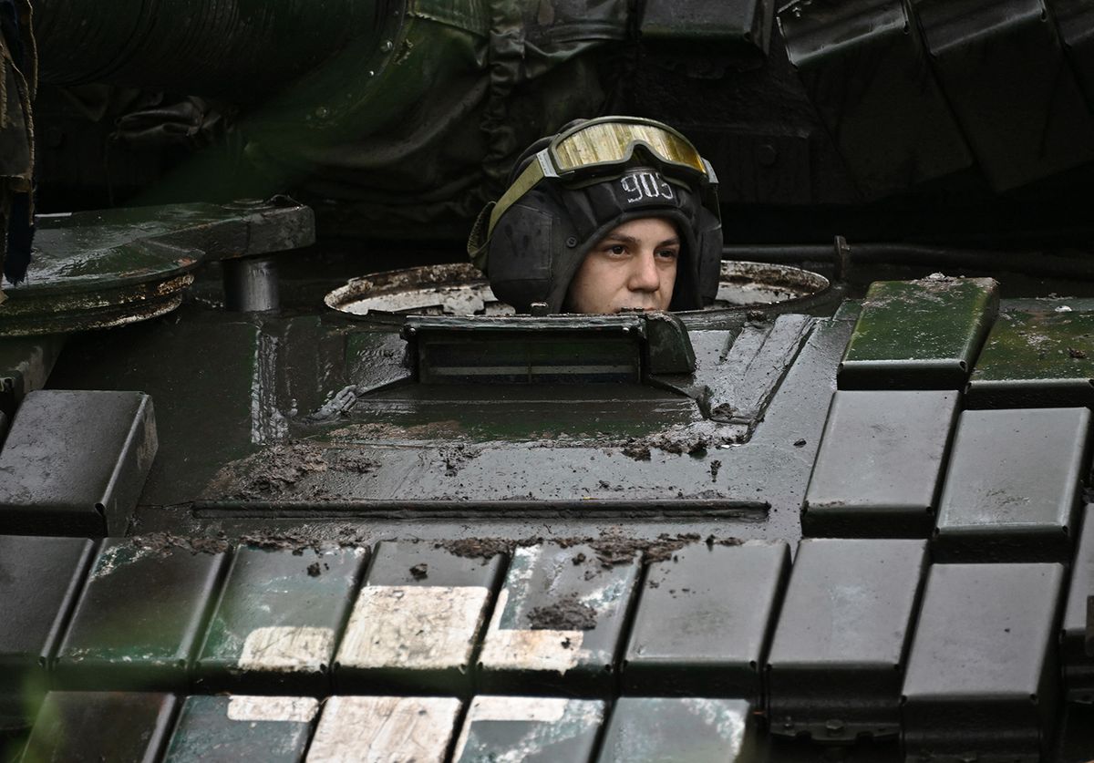 A Ukrainian serviceman sits on a T-72 tank at a position in the Donetsk region on June 25, 2023, amid the Russian invasion of Ukraine. (Photo by Genya SAVILOV / AFP)
