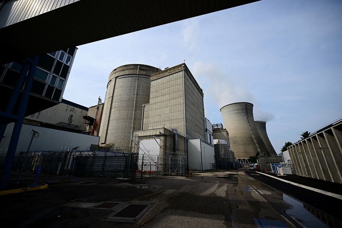 This photograph taken on July 24, 2023, shows cooling towers and a reactor at the Bugey Nuclear Power Plant in Bugey in the Saint-Vulbas commune, eastern France. Two EPR-2 (European Pressurized Reactors) will be built in the Bugey nuclear site, as part of the government's quest for low-carbon electricity. (Photo by Emmanuel DUNAND / AFP)