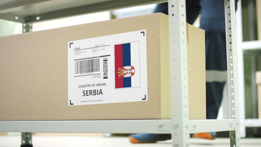 Cardboard,Box,With,Products,From,Serbia,And,Storage,Employee
